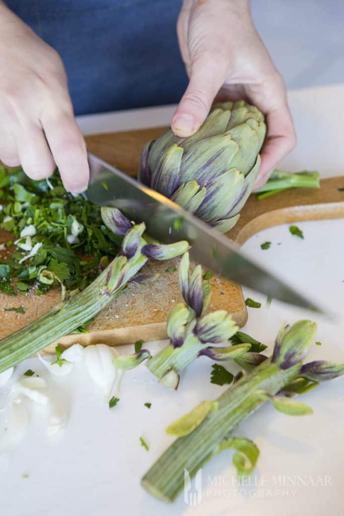 Artichokes being chopped 