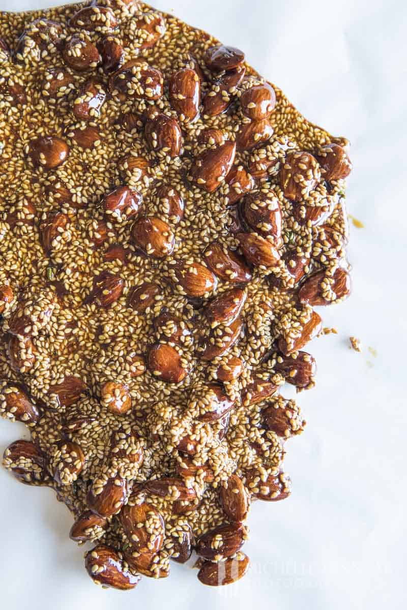 A close up of almond brittle and sesame seeds