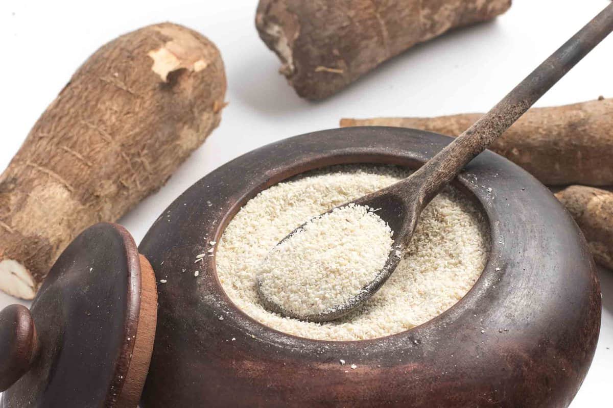 White cassava flour in a wooden bowl 