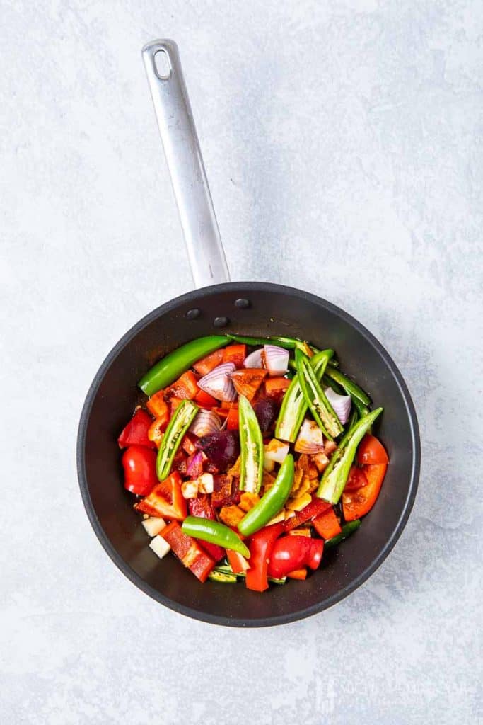 Vegetables sauteeing in a pan 