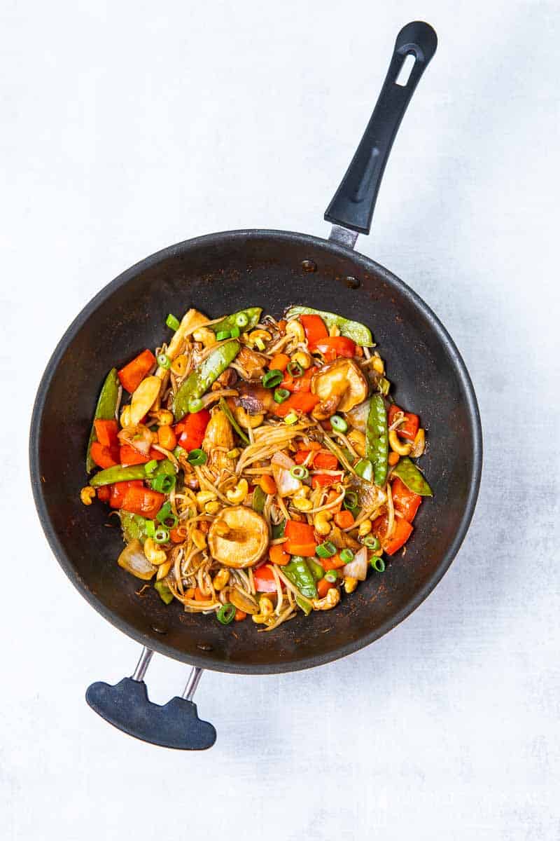 A saute pan full of chinese ingredients to make vegan chop suey