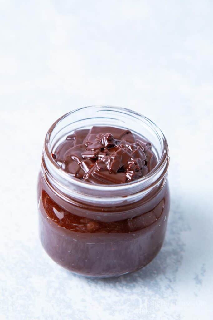 A jar of chocolate fudge sauce