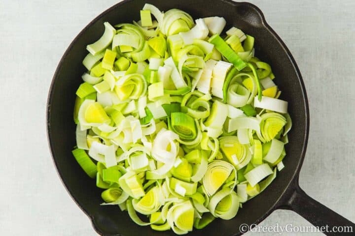 Chopped leeks in a pan.