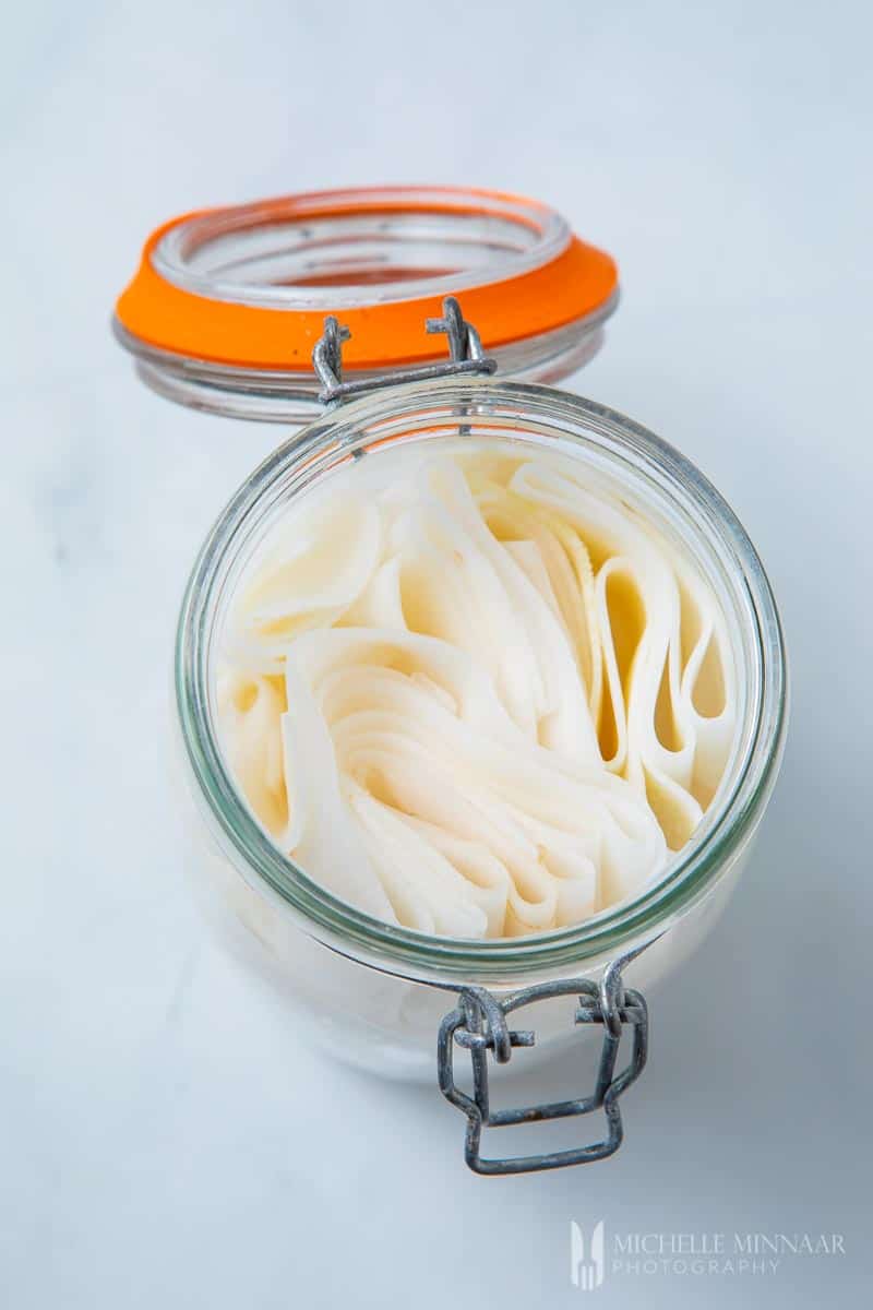 White Pickled radish in a clear jar