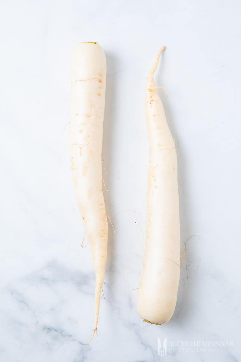 Two white daikon radishes