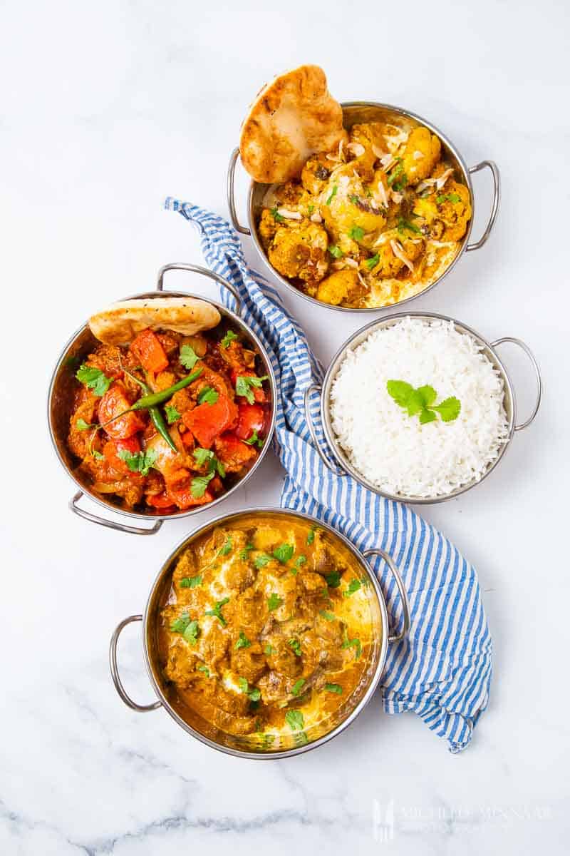 A full indian meal in silver bowls 