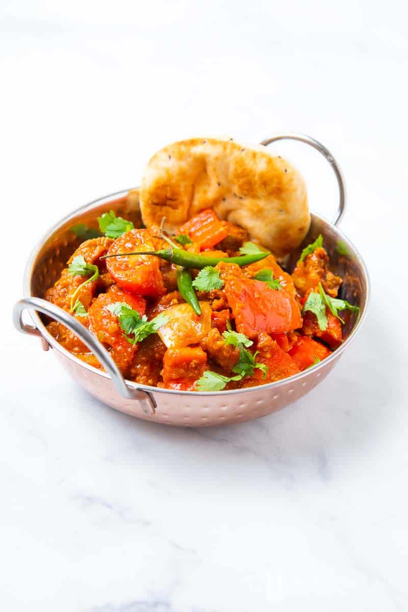 A silver bowl of lamb jalfrezi