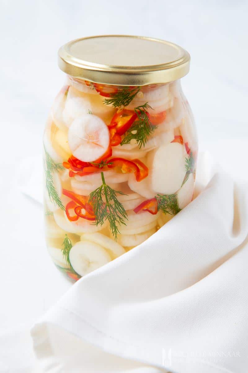 Clear jar of pickled daikon