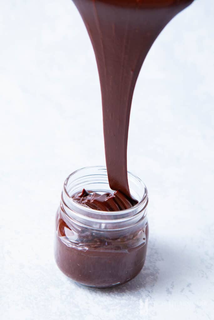 Chocolate being poured into a jar