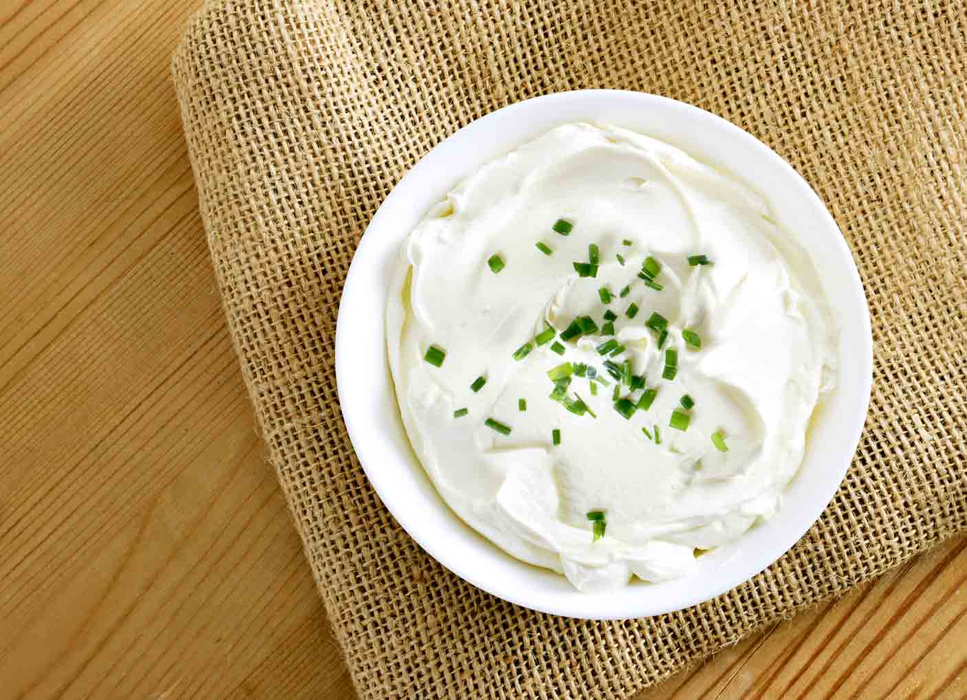 A bowl of white quark cheese.