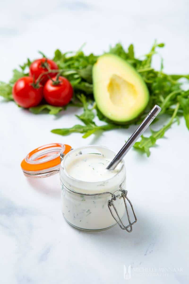 A jar with a silver spoon in it