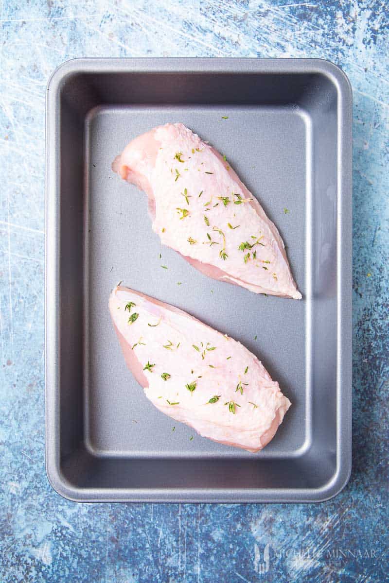 Two raw chicken breasts 