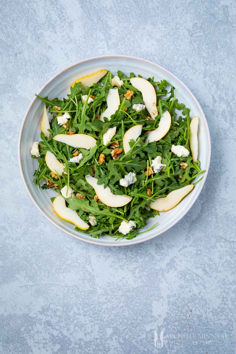 An aerial view of a pear and rocket salad