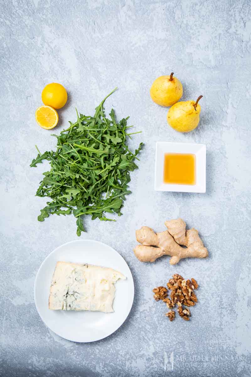 Ingredients to make pear and rocket salad