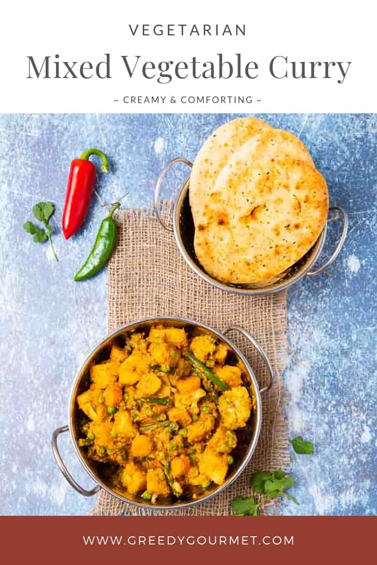 Bowl of mixed vegetable curry and naan bread