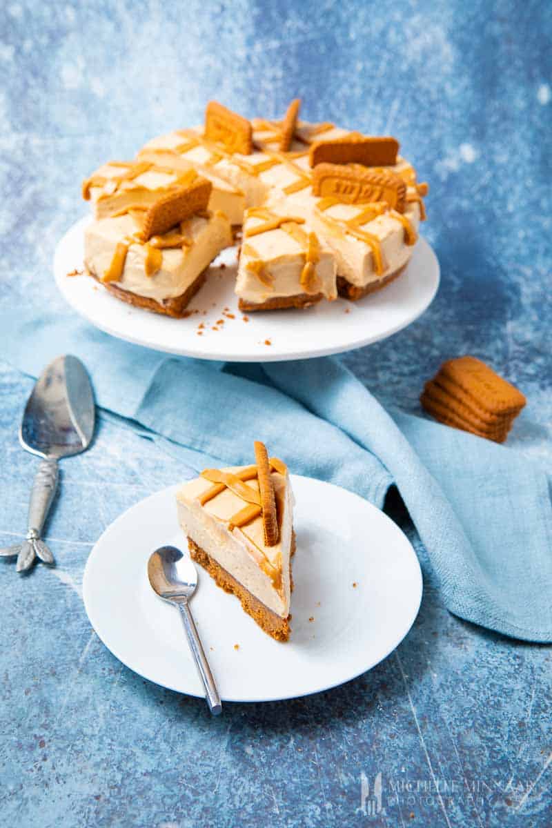 A slice of biscoff cheesecake and a full pie 