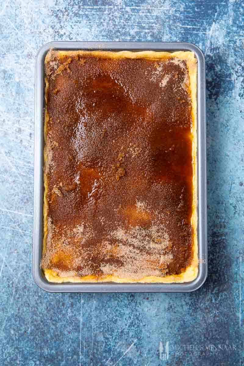 A sopapilla cheesecake with a cinnamon layer on top 