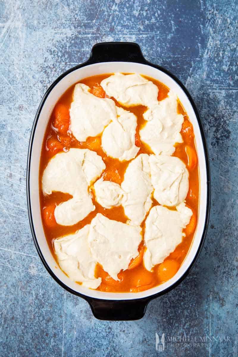 Liquid apricots with a cream topping