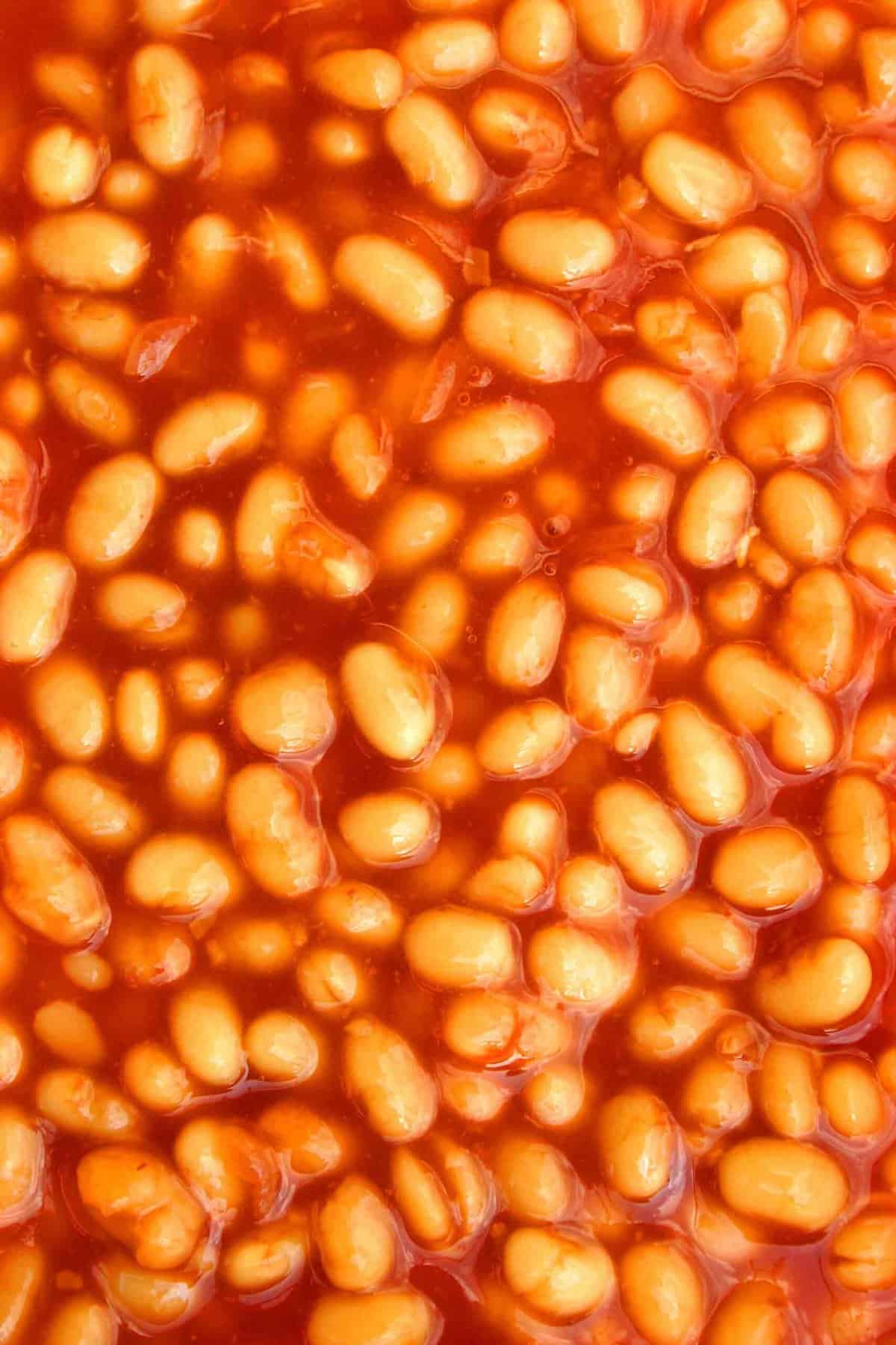 Tray of red bakes beans in sauce 