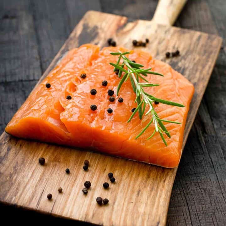 Raw salmon on a cutting board