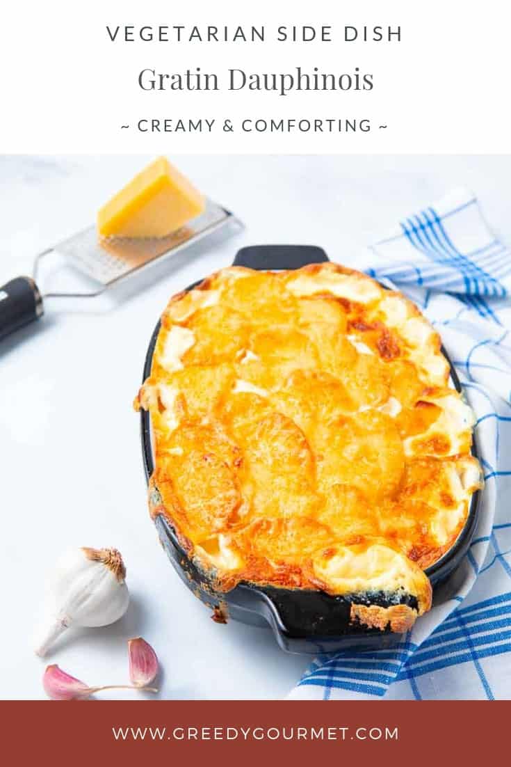 Casserole dish of gratin dauphinois and chunk of cheese