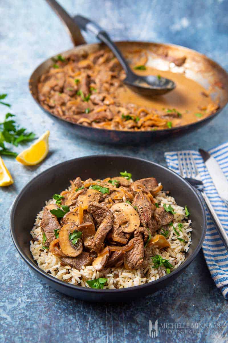 A bowl of rice covered in slimming world beef stroganoff