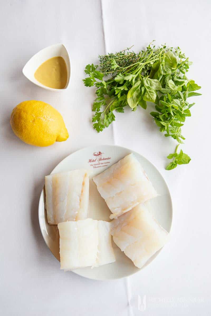 A plate of raw cod to make steamed cod