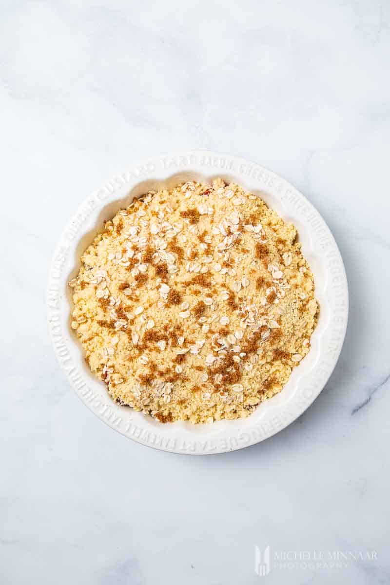 Bowl of fruit with crumble on top