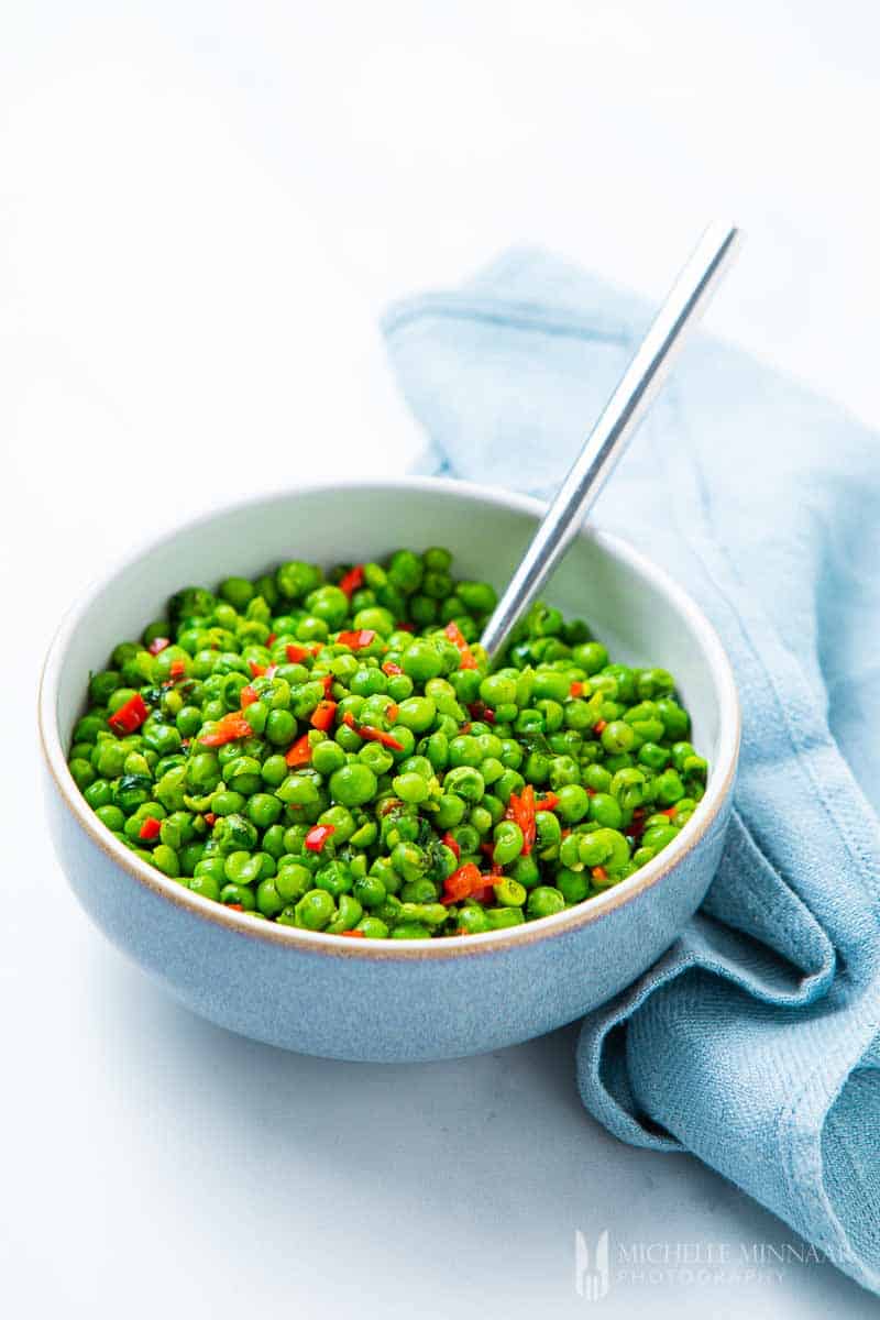 Bowl of green peas and chillis to make macho peas