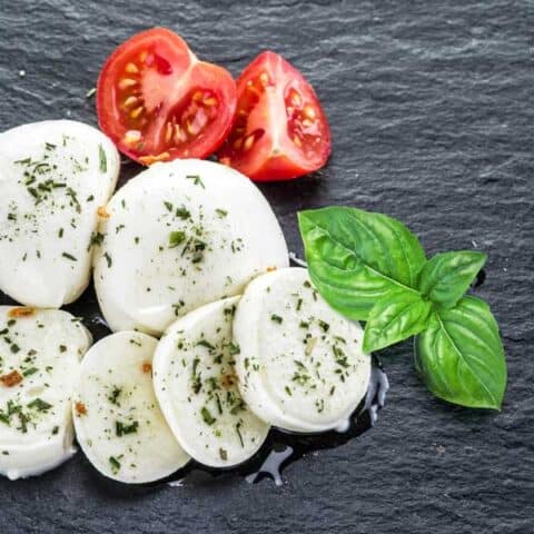 Slices of seasoned mozzarella cheese