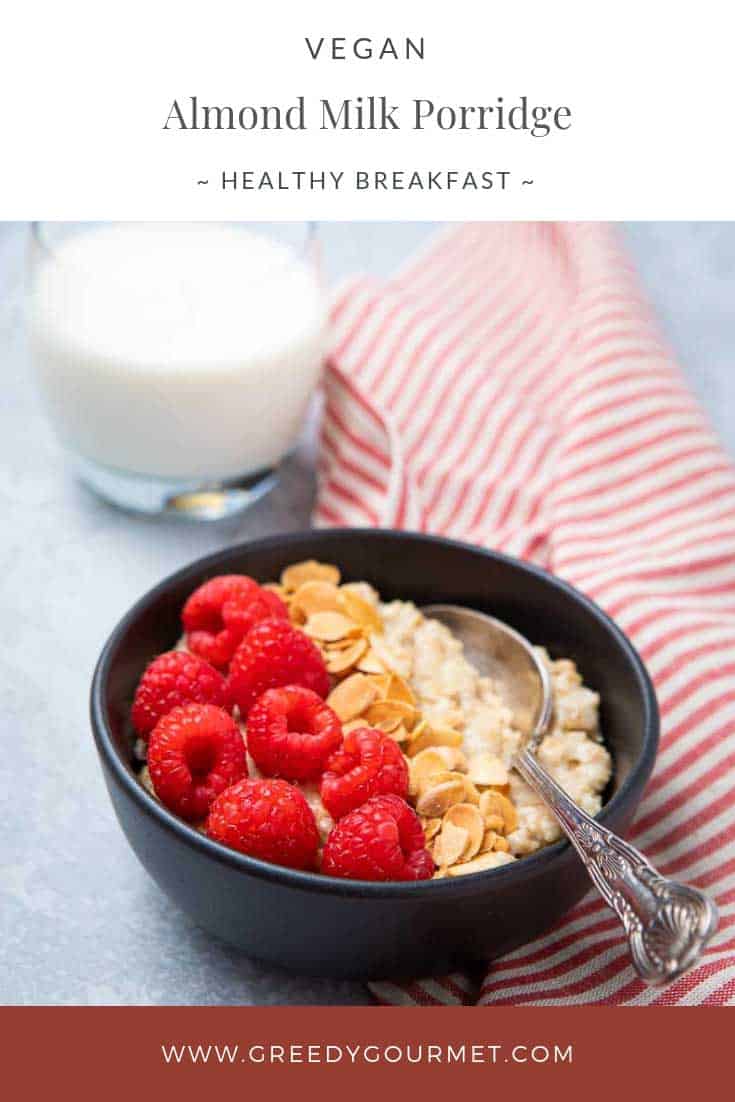 Bowl of almond milk porridge topped with raspberries 