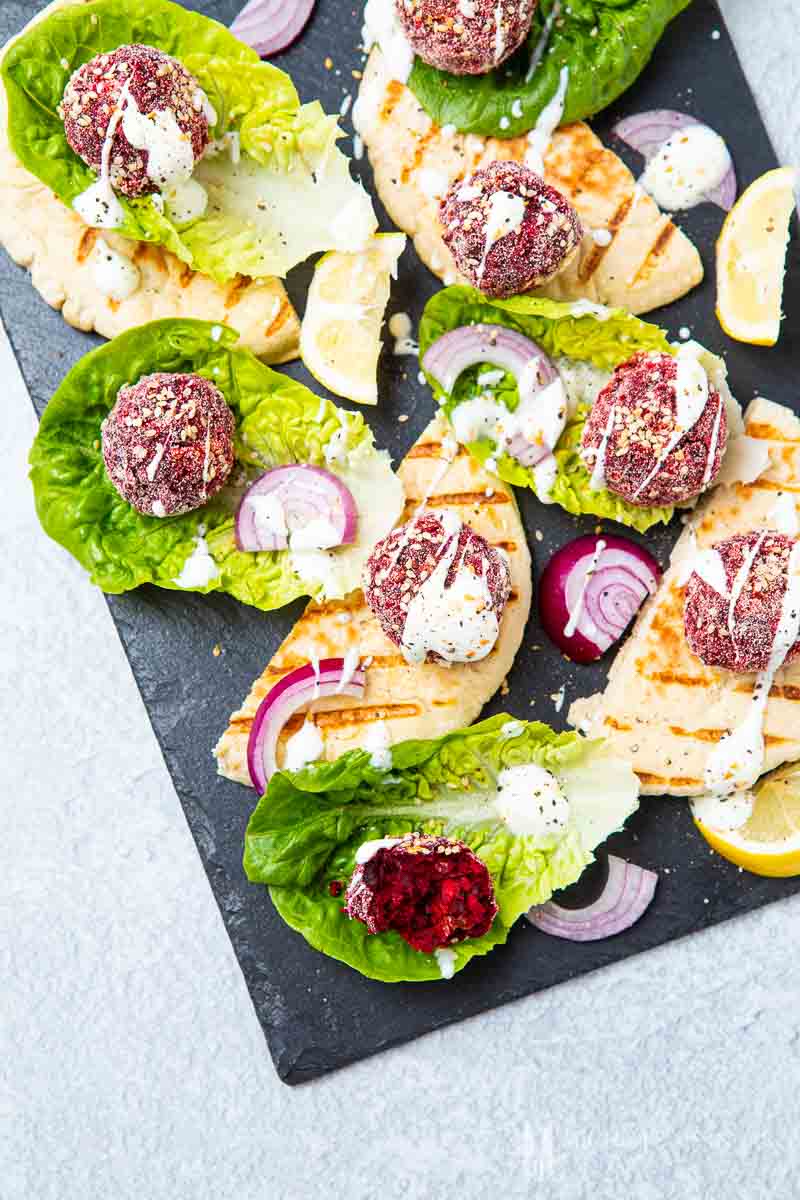 Balls of beetroot and lettuce on a board 
