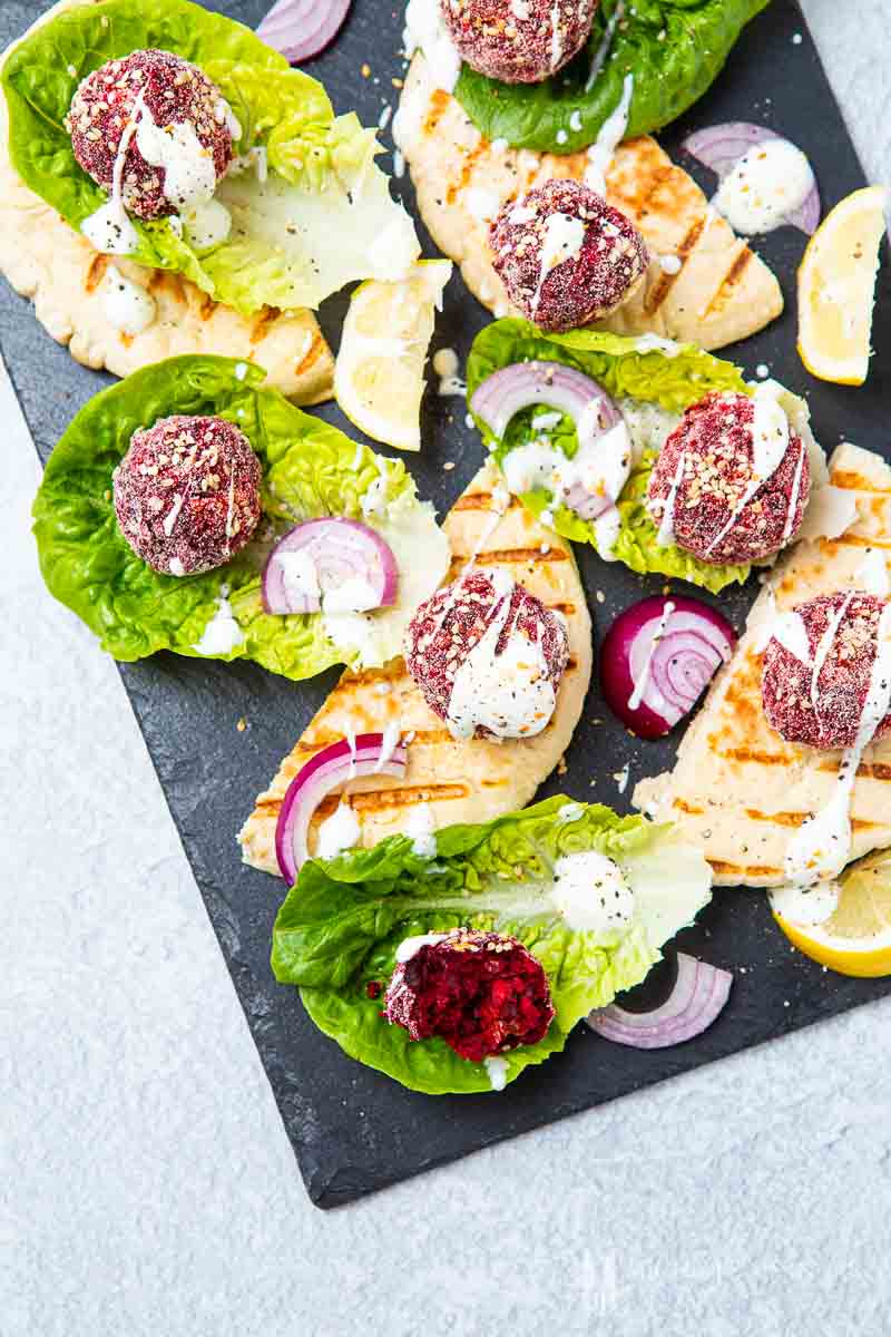 beetroot falafel on serving tray.