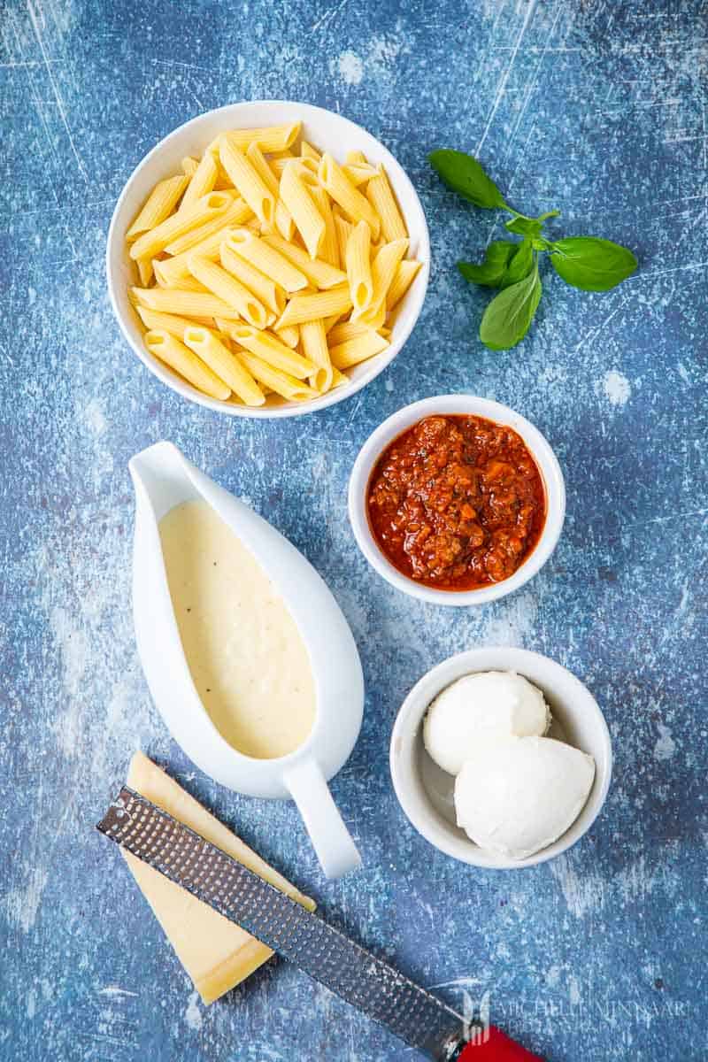 Ingredients to make bolognese pasta bake