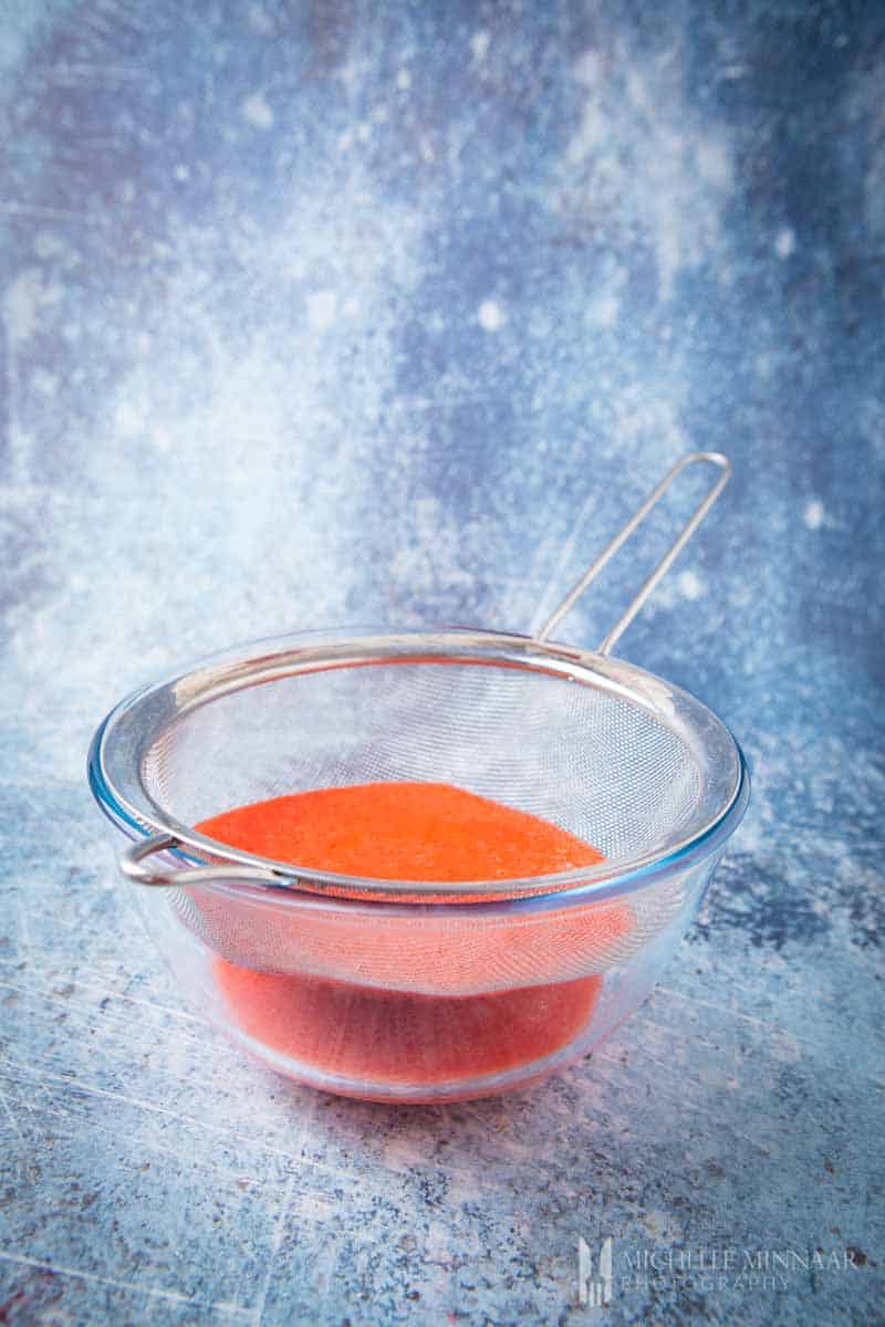 Red powder in a small dish 