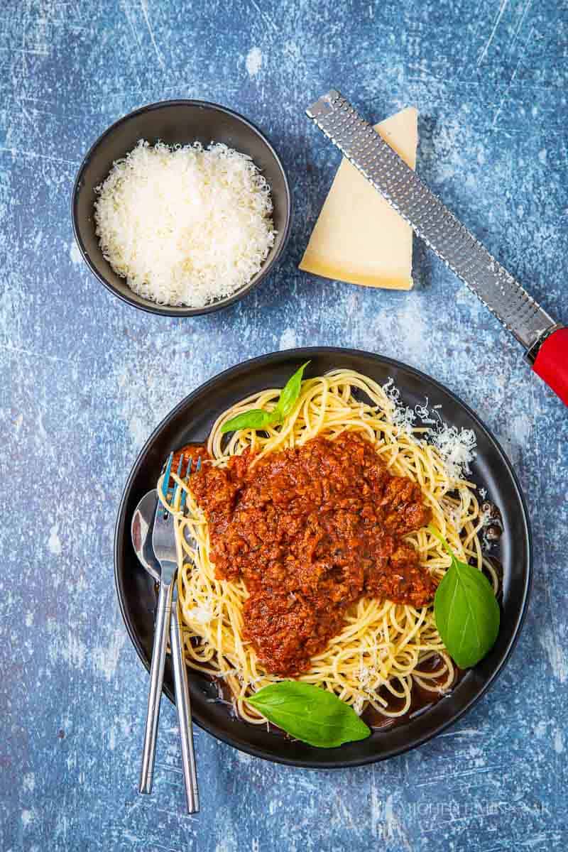 Plate of slimming world spaghetti bolognese and parm cheese