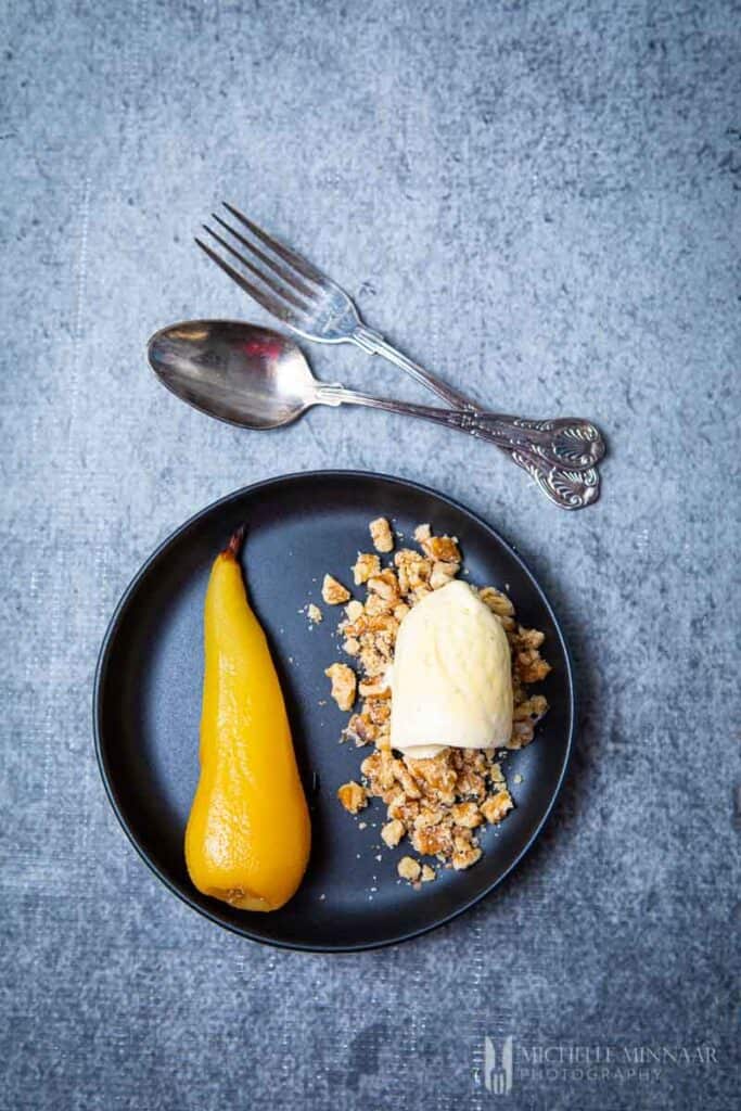 Plate of brandied pears and ice cream
