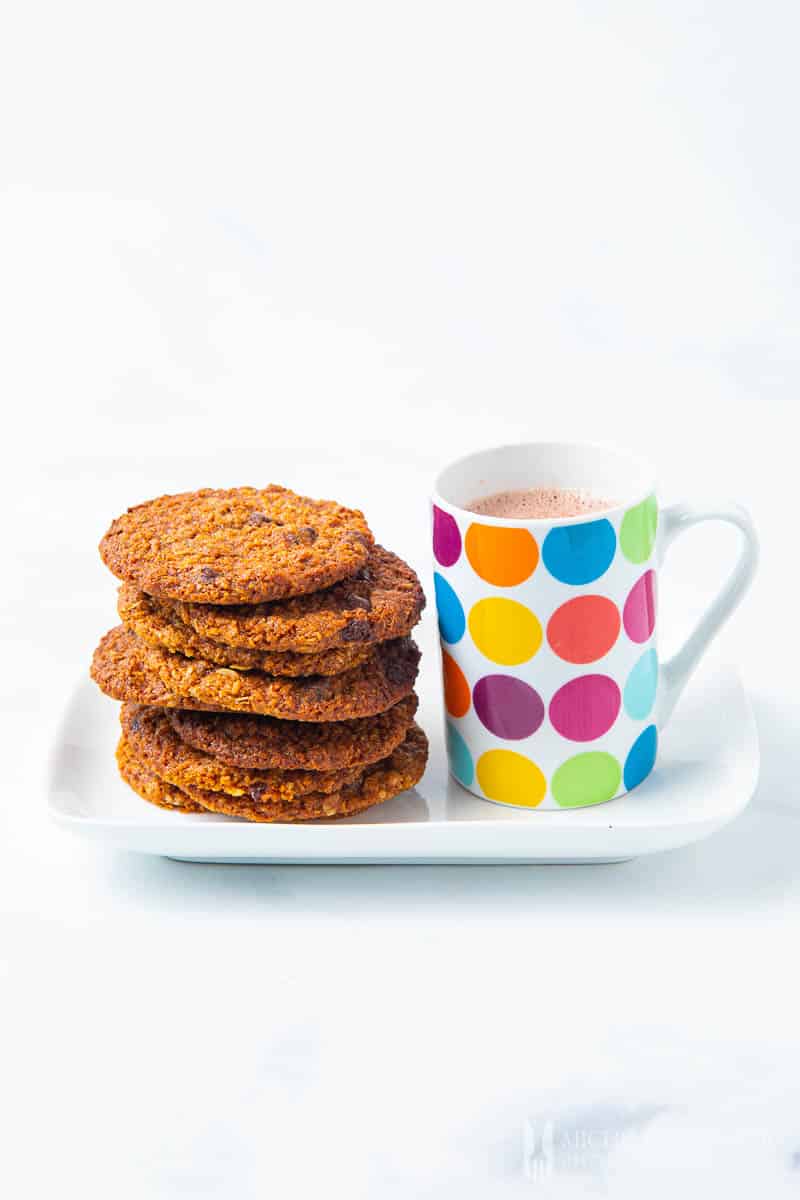 Stack of cookies and mug of milk 