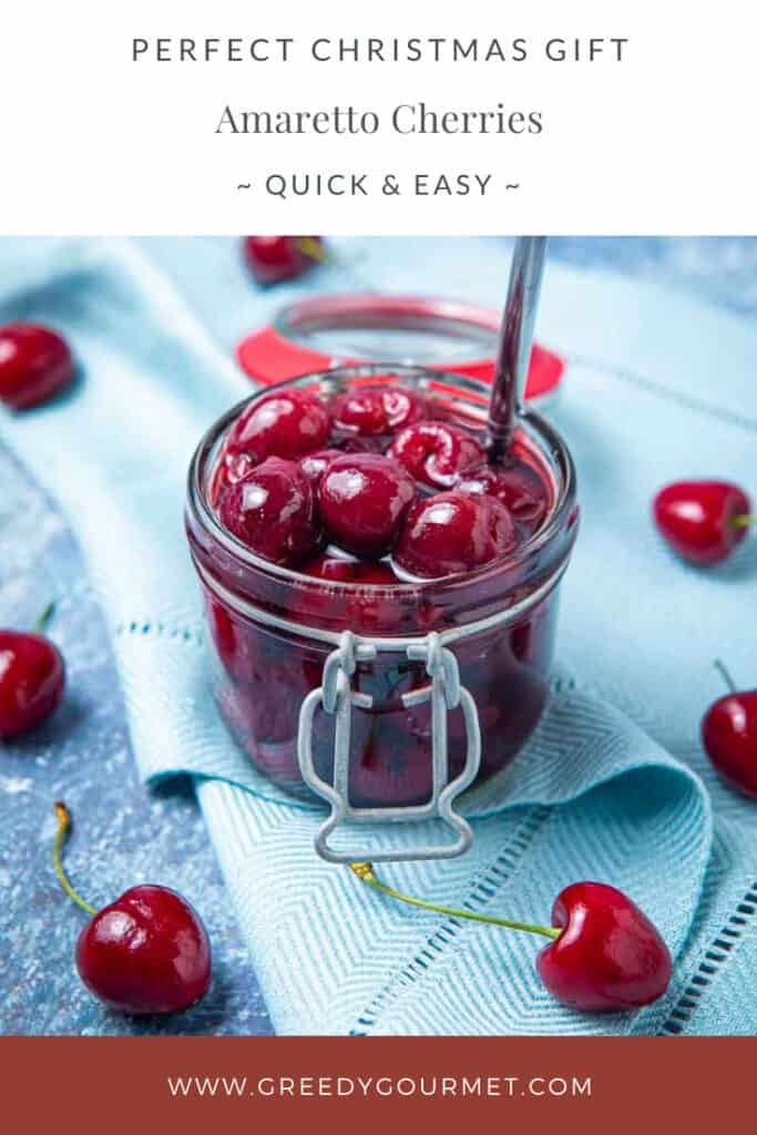 Clear jar of amaretto cherries
