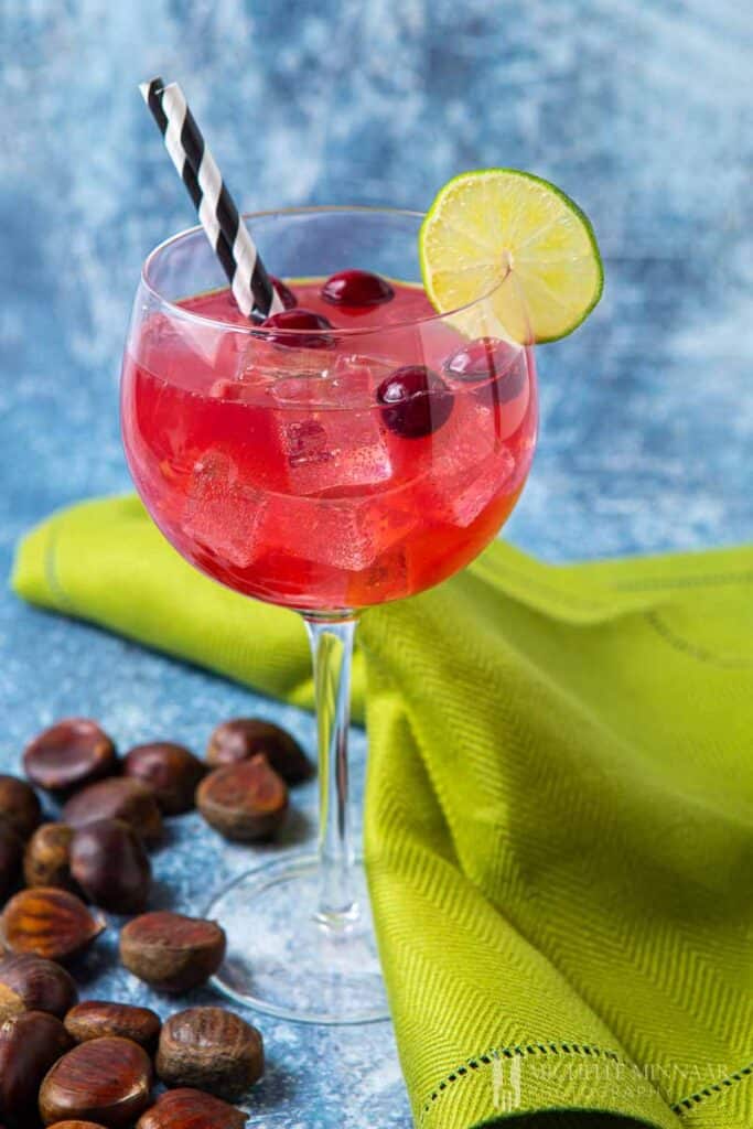 Large red glass of Christmas gin cocktail