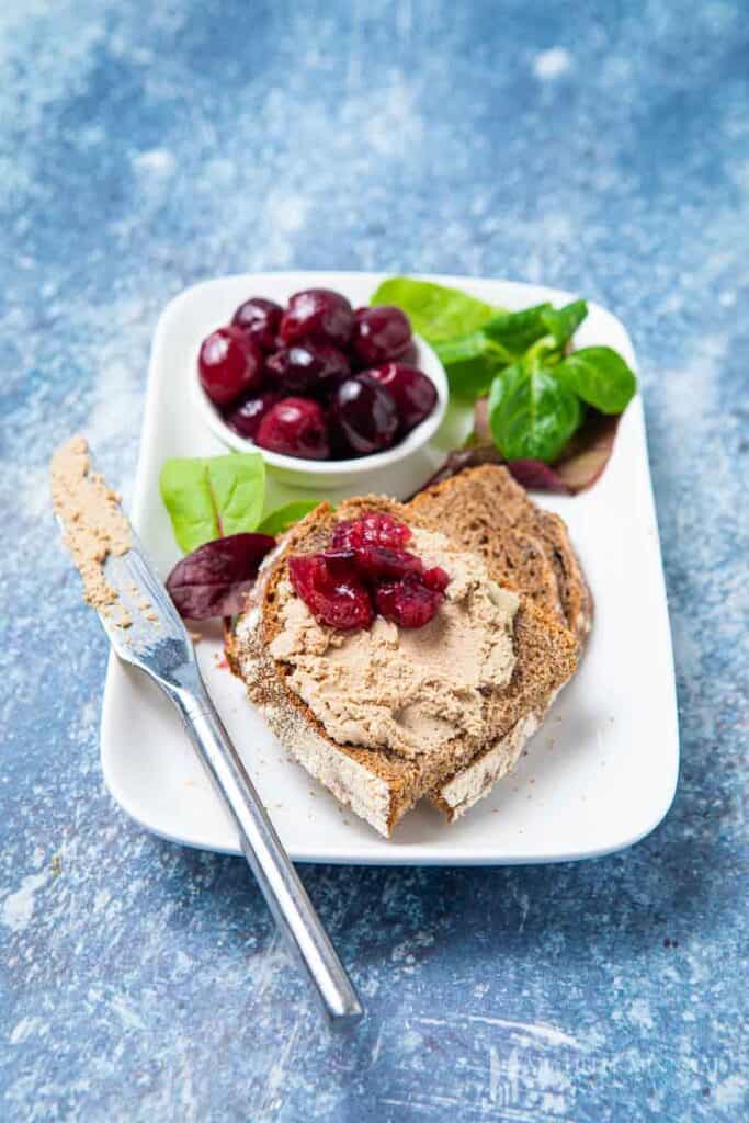 duck liver parfait on bread with a knife