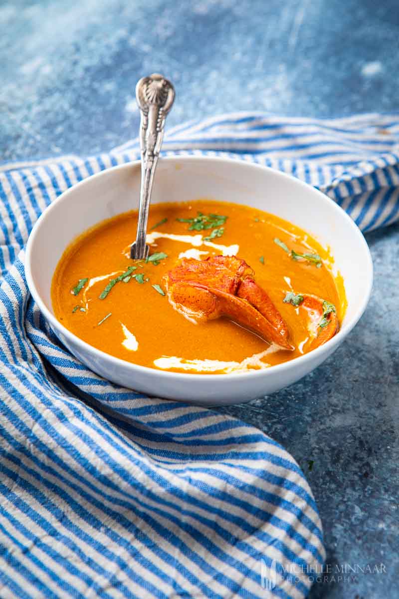 Bowl of orange lobster bisque