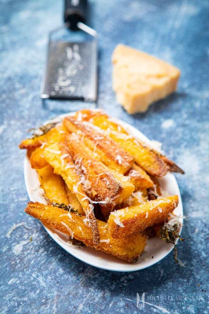 Plate of friend parmesan parsnips