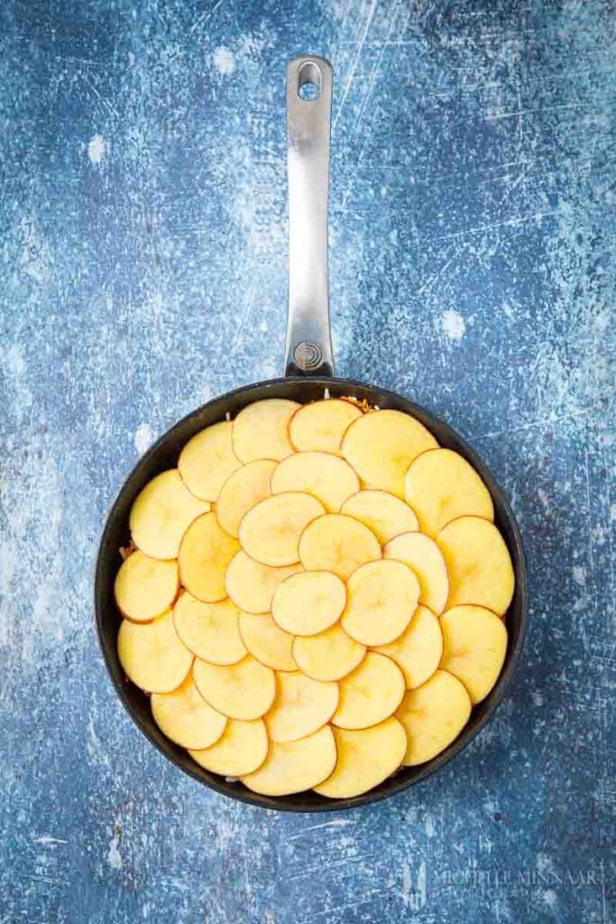 Sliced potatoes in a saute pan