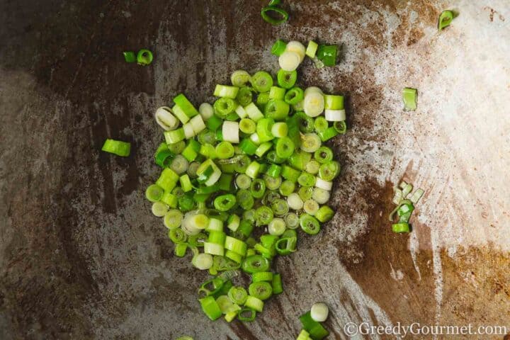 Frying spring onions.