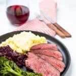 Plate of sous vide beef cheeks with sides