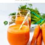 Glass of carrot juice and fresh carrots