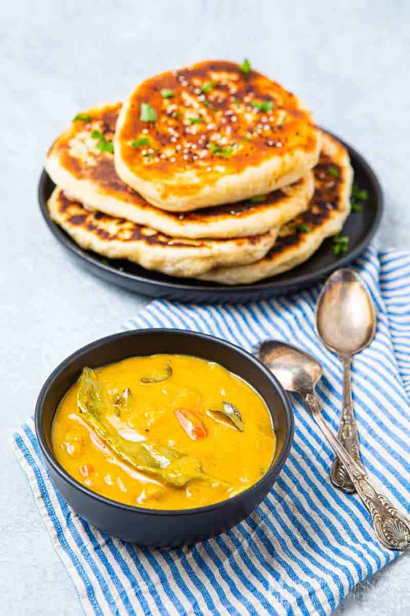 Bowl of Indian chutney with indian bread