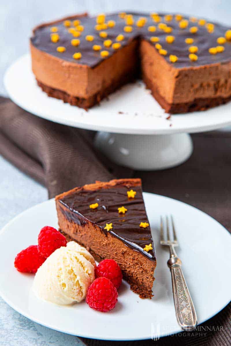 Full chocolate delice cake with a slice removed