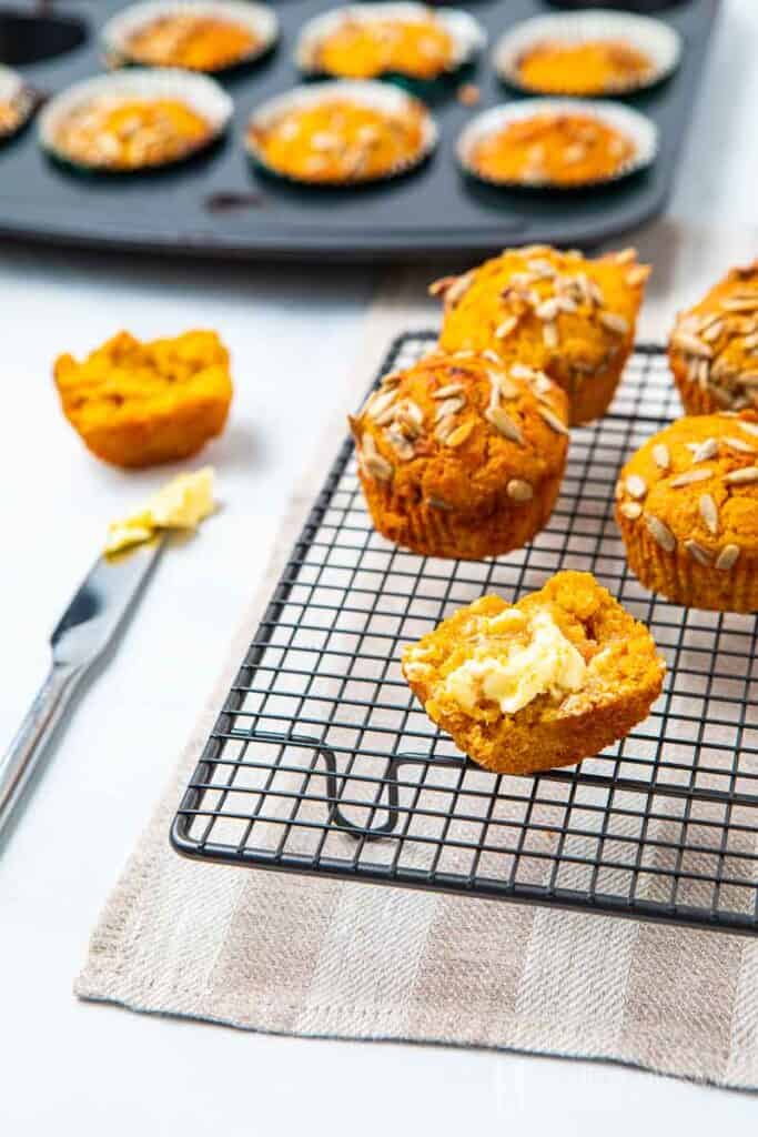 Muffin with butter on a rack